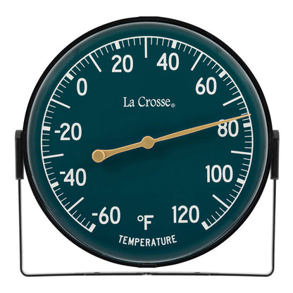 Head-on image of the 104-1512F 5-inch Dial Thermometer with Bracket features an emerald green dial with white temperature readings in a Fahrenheit scale from -60 to 120 degrees, with an antique gold pointer shown with the mounting bracket/stand positioned at the bottom