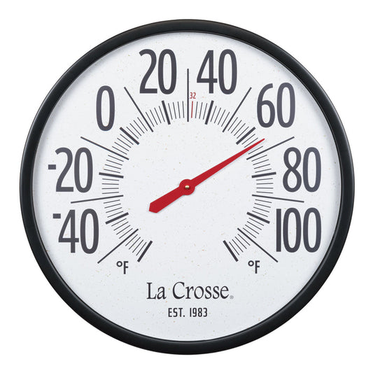 Extra-large oversized circular indoor/outdoor analog dial thermometer measuring 21.80 inches. Black plastic case surrounds a speckled terrazzo white dial and 2.90-inch-tall black numbers ranging from -60 to 120 degrees Fahrenheit. La Crosse logo and “1983” logo are located below the center of dial