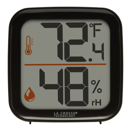 Head-on image of the 302-1407B Thermometer with Temperature and Humidity - Black. The thermometer features a black square case and a digital screen with large temperature and humidity readings. Next to the digits are corresponding temperature and humidity icons in orange.