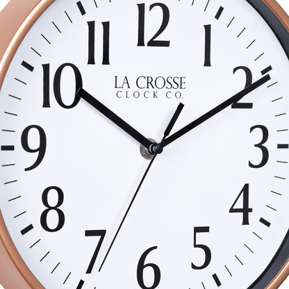 Close-up image of the dial of the 404-3025C 10-inch Basic Decor Wall Clock with a Copper frame, white dial with black numbers, hour, and minute hands, and a black second hand