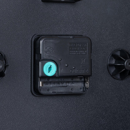 Close-up image of the battery compartment for the 404-3025G 10-inch Basics Wall Clock - Green with Quartz movement and an easy set time wheel
