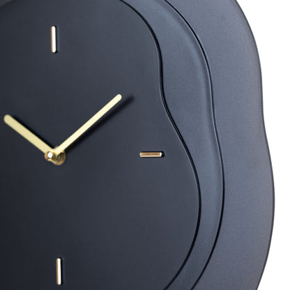 Close-up frame image of the 404-3039B 15.2-inch Drift Wall Clock – Black featuring the open face multi-layered design with drifting contours, metal hands, and raised number markings in a brass finish.