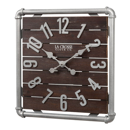 Left-facing image of the 404-3412L 16-inch Foundry Metal & Wood Wall Clock - Light. The clock features a square metal pipe frame in a weathered pewter finish, a truffle-brown-stained wood slat clock face with pewter-finished metal numbers and hands.