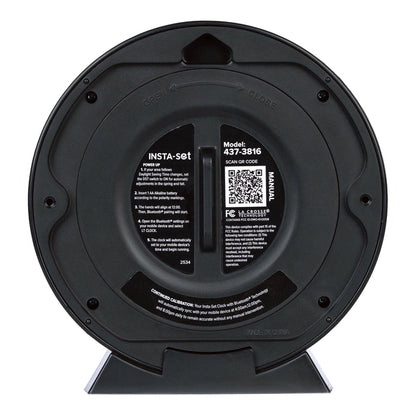 Head-on back image of the 437-3816 Insta-Set Table/Wall Clock with Bluetooth® Technology showing  the back of the clock with the battery cover on and the instructions printed on the back with a support QR code.
