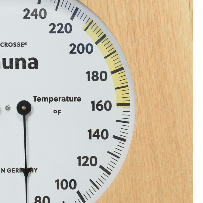 Close up image of the temperature gauge of the 914-620 Sauna Thermometer and Hygrometer in a wood frame showing the black pointer and the temperature in degrees Fahrenheit.
