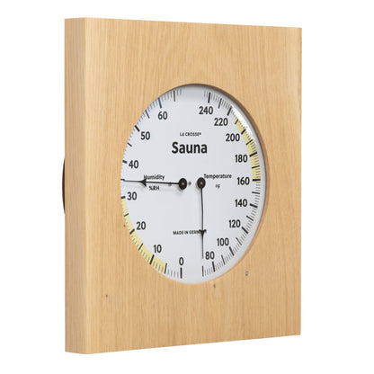 Right facing image of the 914-620 Sauna Thermometer and Hygrometer dial in oiled oak wood casing displaying a dial split in half with temperature on the right in Fahrenheit from 60 degrees to 245 degrees with optimal range in yellow and the left half showing humidity readings from 0 percent to 75 percent with the optimal range highlighted in yellow