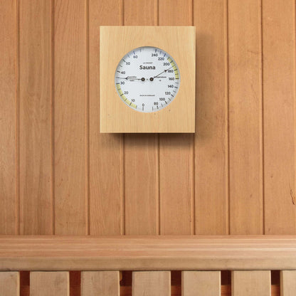 914-620 Sauna Thermometer and Hygrometer lifestyle image displays it hanging on the wall in a sauna. A white dial in a wood frame and black numbering reads the temperature and the humidity with the optimal ranges highlighted in yellow. Decorative black metal pointers read 35 percent humidity and 190 degrees Fahrenheit. The temperature ranges from 70 degrees Fahrenheit to 240 degrees Fahrenheit, and the humidity ranges from 0 to 70 percent relative humidity.