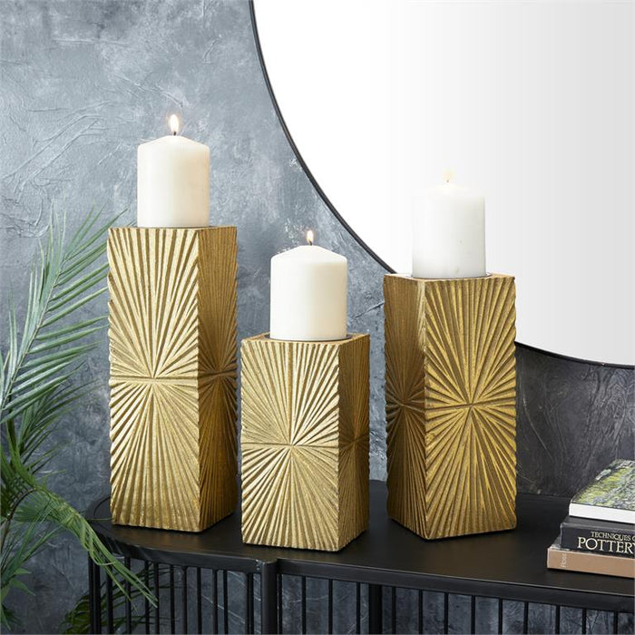 COSMOPOLITAN GOLD WOOD GEOMETRIC CARVED PILLAR CANDLE HOLDER, SET OF 3